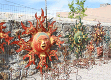 Tin sun faces, wall art in Las Cruces 